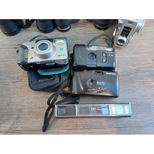 698 - A collection of cameras and binoculars to include cased Olympus iS-3000 35mm bridge camera, Canon AF... 