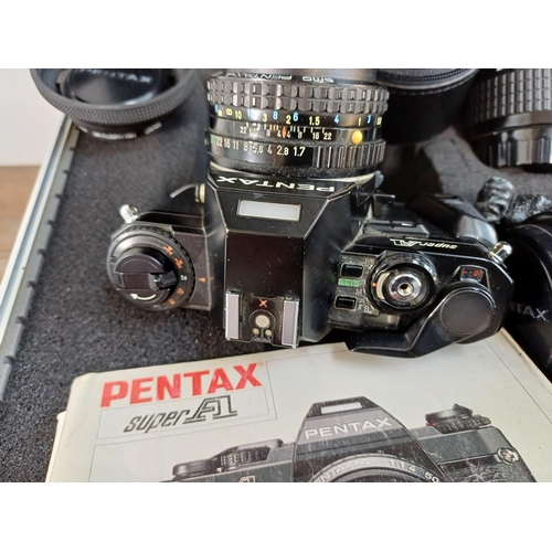 701 - An aluminium flight case containing Pentax 35mm cameras and lenses, Super A SLR fitted with 1:1.7 50... 