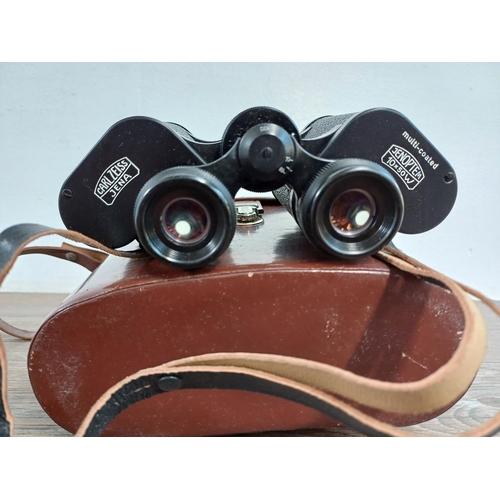 702 - A cased pair of Carl Zeiss Jenoptem 10 x 50w binoculars