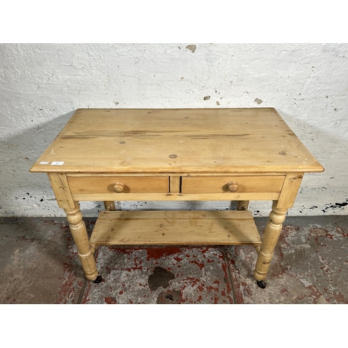 99 - A Victorian pine two drawer wash stand/console table - approx. 73cm high x 95cm wide x 52cm deep