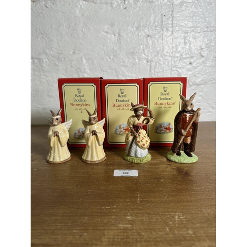 302 - Four Royal Doulton Bunnykins figurines, Little John, Little Bo Peep and two Angel