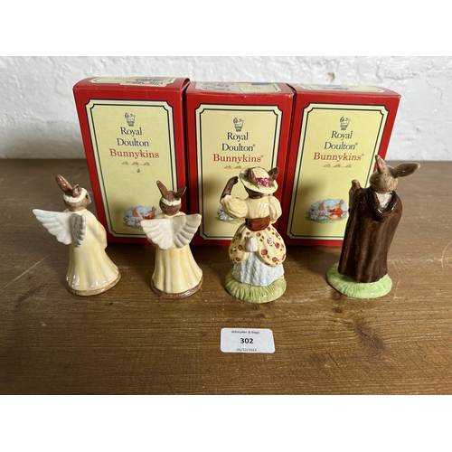 302 - Four Royal Doulton Bunnykins figurines, Little John, Little Bo Peep and two Angel