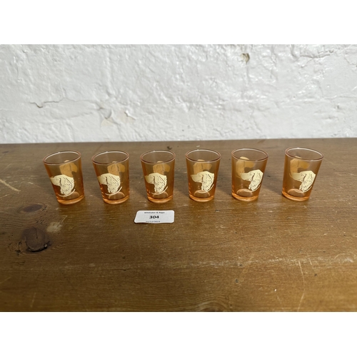 304 - A mid 20th century Art Deco style French peach glass seven piece drinking set with enamelled hunting... 