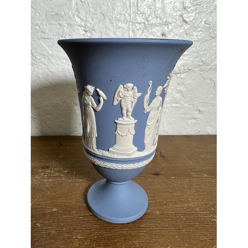 306 - Three pieces of Wedgwood Jasperware, two pale blue vases - largest approx. 19cm high and one sage gr... 