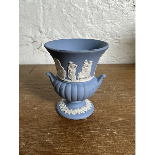 306 - Three pieces of Wedgwood Jasperware, two pale blue vases - largest approx. 19cm high and one sage gr... 