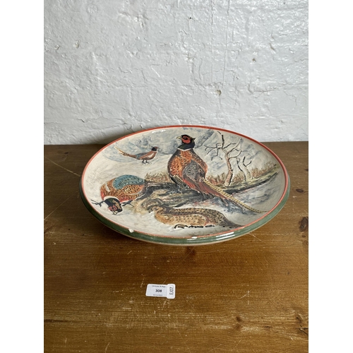 308 - A 1994 Rodney George pheasant scene hand painted studio pottery wall charger - approx. 39cm diameter