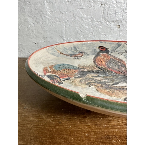 308 - A 1994 Rodney George pheasant scene hand painted studio pottery wall charger - approx. 39cm diameter