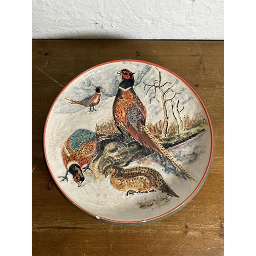 308 - A 1994 Rodney George pheasant scene hand painted studio pottery wall charger - approx. 39cm diameter