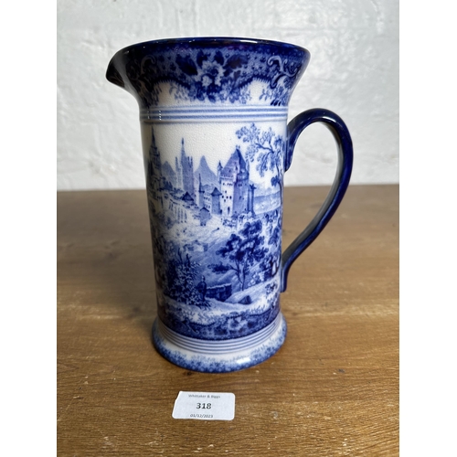 318 - An early 20th century Doulton's Switzerland pattern flow blue pitcher - approx. 21cm high