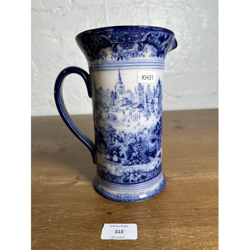 318 - An early 20th century Doulton's Switzerland pattern flow blue pitcher - approx. 21cm high