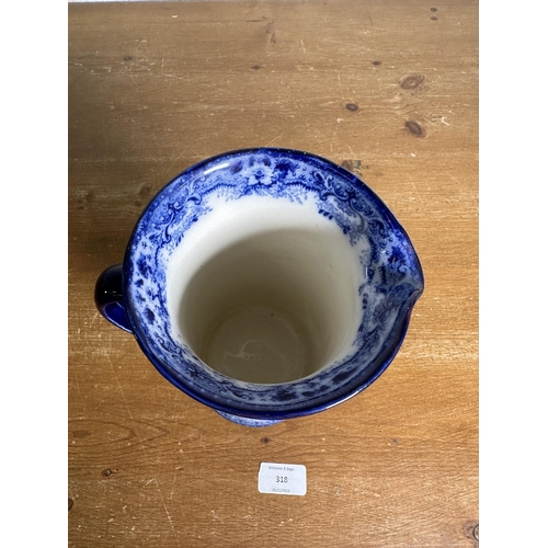 318 - An early 20th century Doulton's Switzerland pattern flow blue pitcher - approx. 21cm high