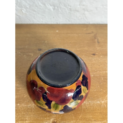 322 - A Moorcroft style Pomegranate pattern tubelined vase - approx. 12cm high