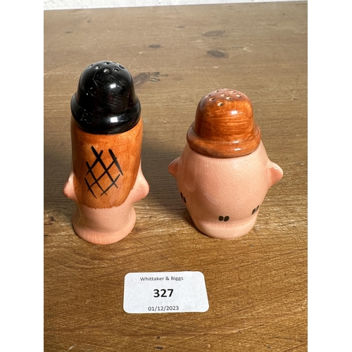 327 - A pair of Beswick Laurel and Hardy salt and pepper shakers - largest approx. 10cm high