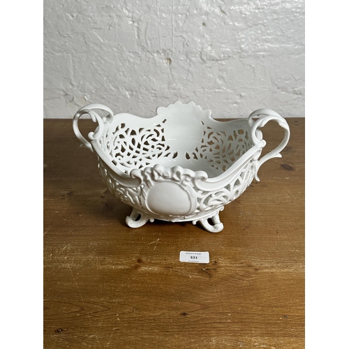 331 - An antique Meissen reticulated porcelain twin handled fruit bowl - approx. 17cm high x 30cm wide