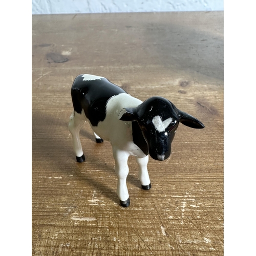 336 - Three Beswick Friesian Cattle figurines, Claybury Leegwater Cow no. 1362A, Calf no. 1249C and CH. Co... 