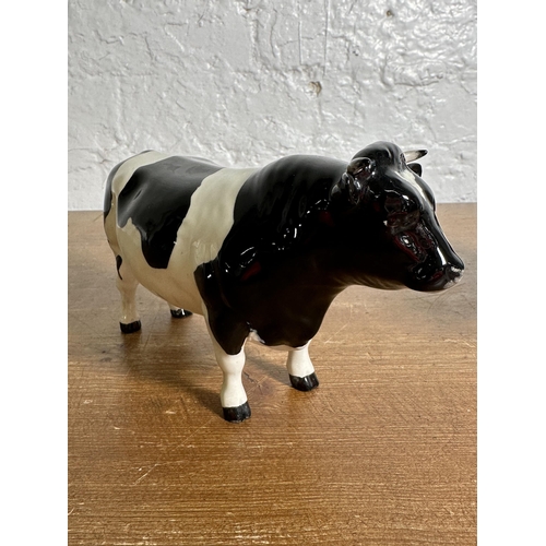 336 - Three Beswick Friesian Cattle figurines, Claybury Leegwater Cow no. 1362A, Calf no. 1249C and CH. Co... 