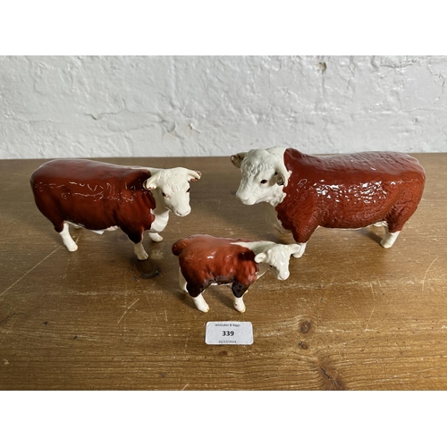 339 - Three Beswick Hereford Cattle figurines, CH. of Champions Bull no. 1363B, CH. of Champions Cow no. 1... 