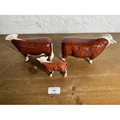 339 - Three Beswick Hereford Cattle figurines, CH. of Champions Bull no. 1363B, CH. of Champions Cow no. 1... 