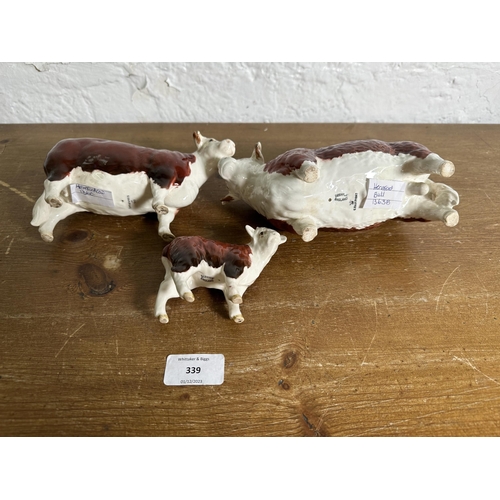 339 - Three Beswick Hereford Cattle figurines, CH. of Champions Bull no. 1363B, CH. of Champions Cow no. 1... 