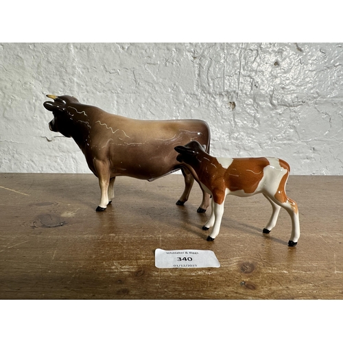 340 - Two Beswick cattle figurines, CH. Dunsley Coy Boy Jersey Bull - no. 1422 and Guernsey Calf - no. 124... 