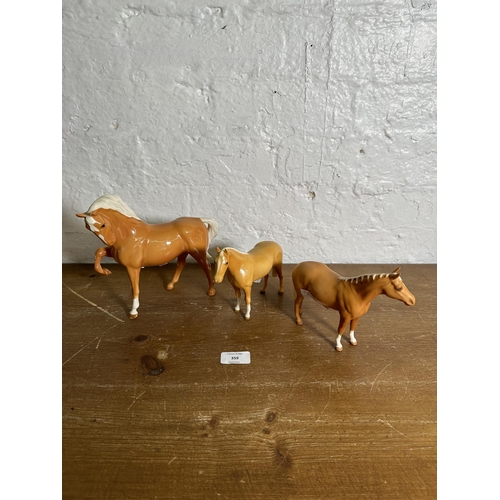 359 - Three Beswick Palomino horse figurines to include Head Tucked Leg Up no. 1549 etc.