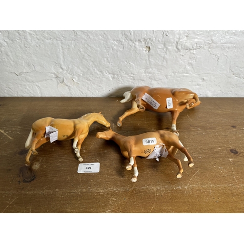 359 - Three Beswick Palomino horse figurines to include Head Tucked Leg Up no. 1549 etc.