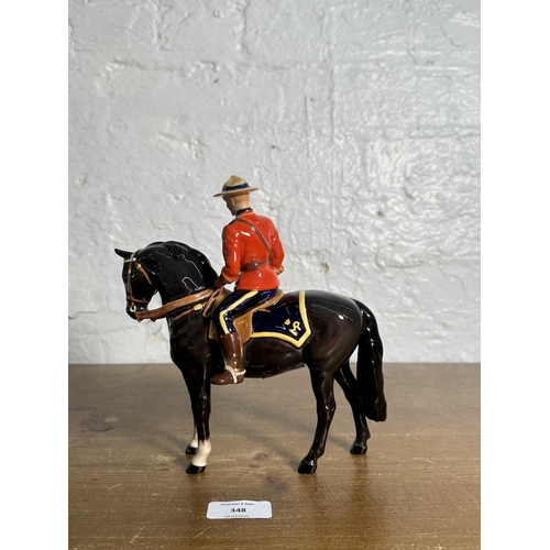 348 - A Beswick Canadian Mountie figurine, no. 1375 - approx. 21cm high