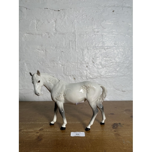 354 - A Beswick Mare Facing Left dapple grey horse figurine, no. 976 - approx. 17cm high