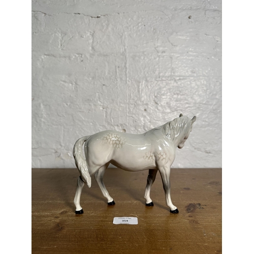 354 - A Beswick Mare Facing Left dapple grey horse figurine, no. 976 - approx. 17cm high