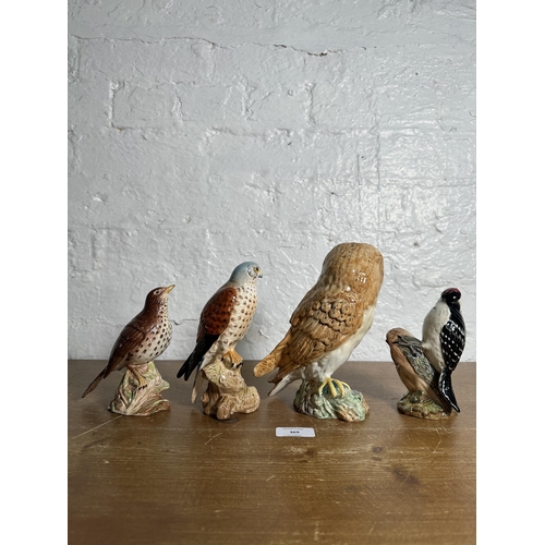 369 - Four Beswick bird figurines, Lesser Spotted Woodpecker no. 2420, Kestrel no. 2316, Songthrush no. 23... 