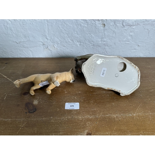 379 - Two Beswick wild cat figurines, Puma on Rock no. 1823 and Lion Cub no. 2098