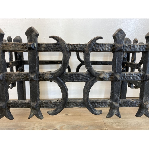 473 - Two pieces of metalware, one 19th century style black painted cast iron fire grate and one cast meta... 