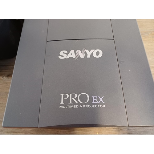 708 - Two items, one cased Sanyo Pro EX PLC-8810E multimedia projector and one FINS Jolly De Luxe projecto... 