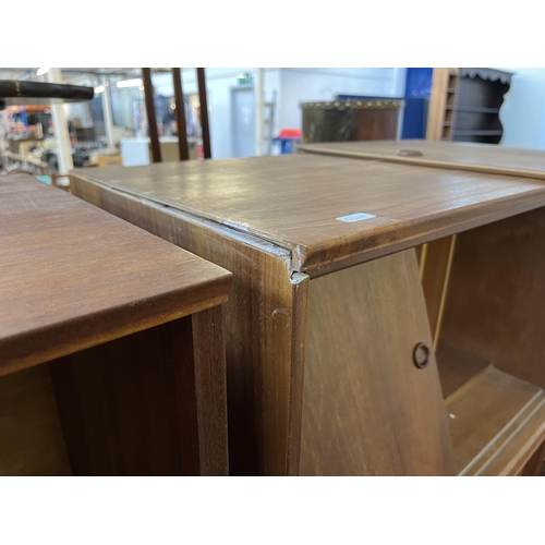 144 - Six mid 20th century teak wall hanging cabinets - each approx. 44cm high x 70cm wide x 38cm deep