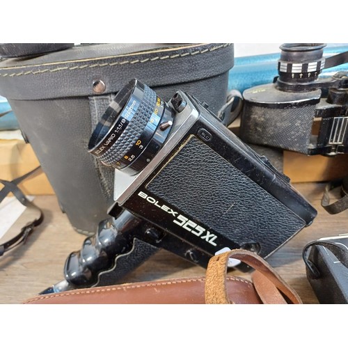 714 - A collection of items to include Pentacon Prakticar 1:2.4 f=50mm lens, 1970s Bolex 525XL Super8 cine... 