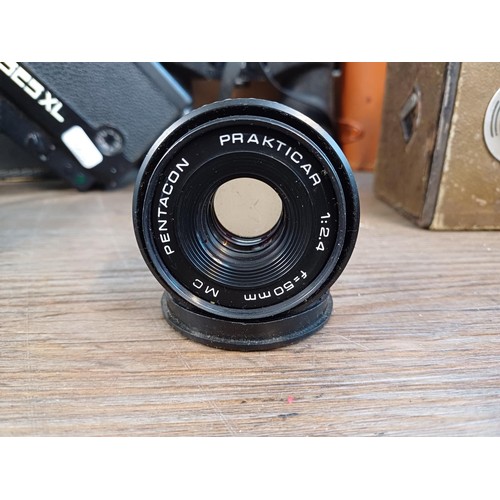 714 - A collection of items to include Pentacon Prakticar 1:2.4 f=50mm lens, 1970s Bolex 525XL Super8 cine... 