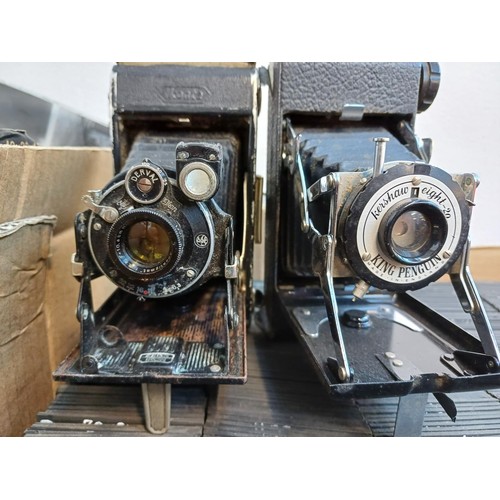 716 - A collection of items to include a very large quantity of glass slides, Zeiss Ikon Ikonta folding ca... 