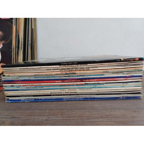 780 - A box containing a collection of vinyl records to include Tyree Glenn, Sonny Boy Williamson, Meade L... 