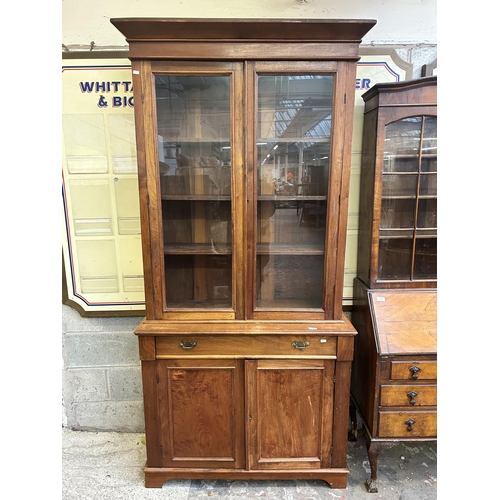 1 - A Victorian satinwood bookcase with two upper glazed doors and two lower cupboard doors - approx. 22... 