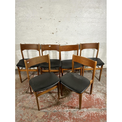 101 - Six mid 20th century teak and black vinyl dining chairs