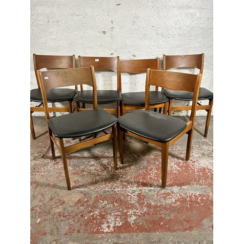 101 - Six mid 20th century teak and black vinyl dining chairs