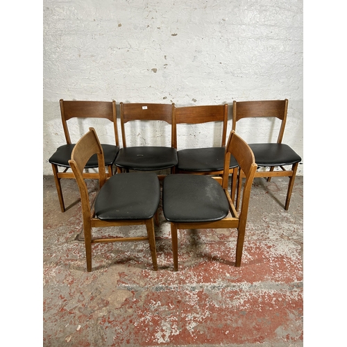 101 - Six mid 20th century teak and black vinyl dining chairs