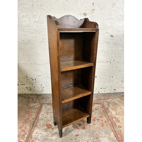 102 - A mid 20th century oak miniature four tier bookcase - approx. 93cm high x 31cm wide x 16cm deep