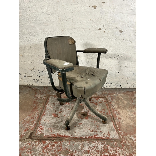 108 - A mid 20th century green metal and vinyl industrial swivel office desk chair stamped 