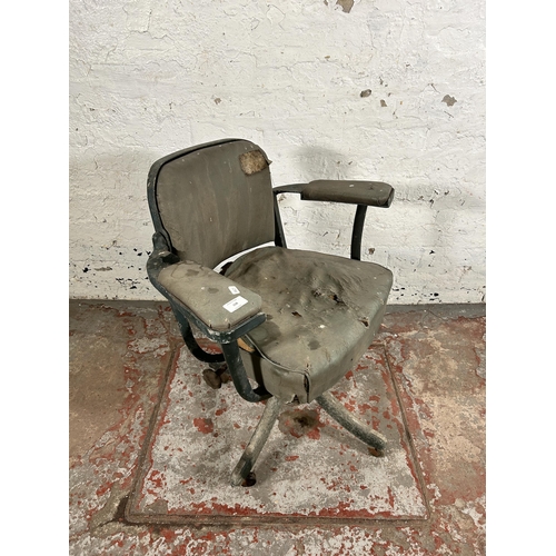 108 - A mid 20th century green metal and vinyl industrial swivel office desk chair stamped 