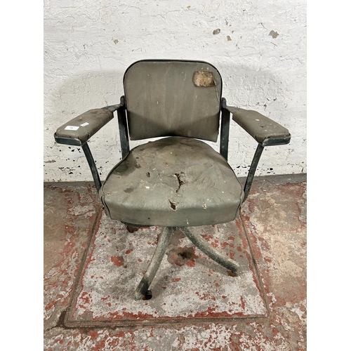 108 - A mid 20th century green metal and vinyl industrial swivel office desk chair stamped 