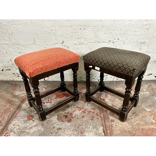 111 - A pair of oak and fabric upholstered pub stools