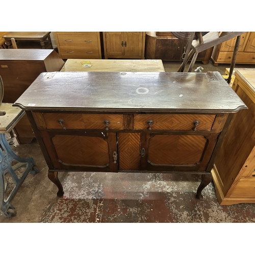 115 - An early 20th century mahogany sideboard on cabriole supports - approx. 92cm high x 122cm wide x 47c... 