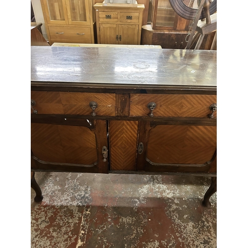 115 - An early 20th century mahogany sideboard on cabriole supports - approx. 92cm high x 122cm wide x 47c... 