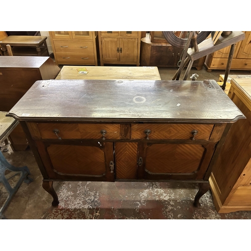 115 - An early 20th century mahogany sideboard on cabriole supports - approx. 92cm high x 122cm wide x 47c... 